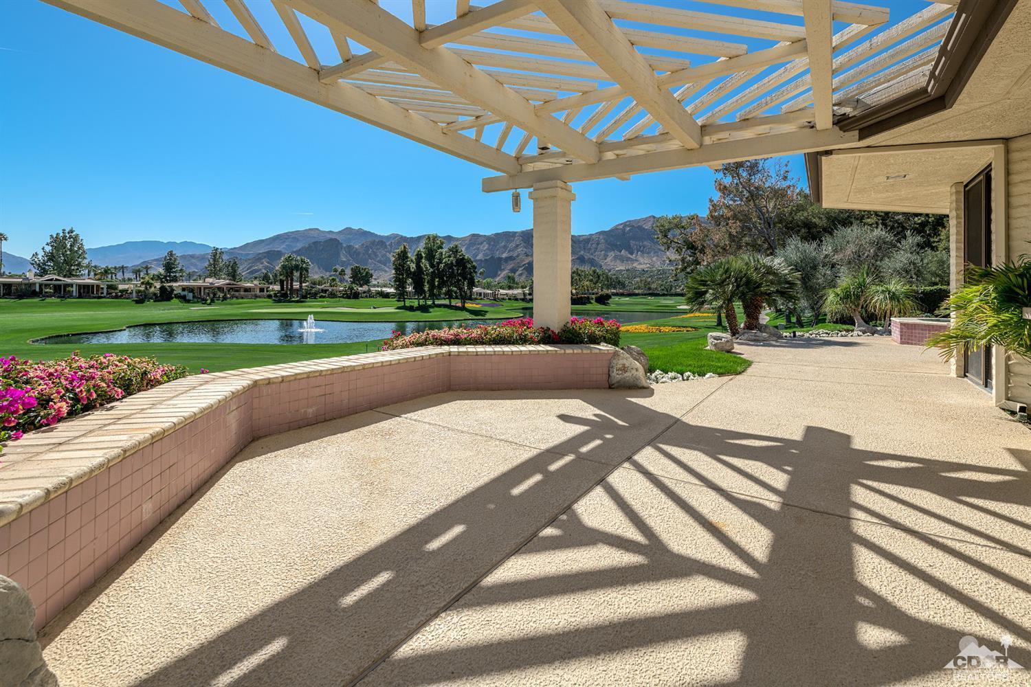24 Johnar Boulevard Rancho Mirage, CA 92270 - Photo 2 of 26 a view of a patio with a table and chairs
