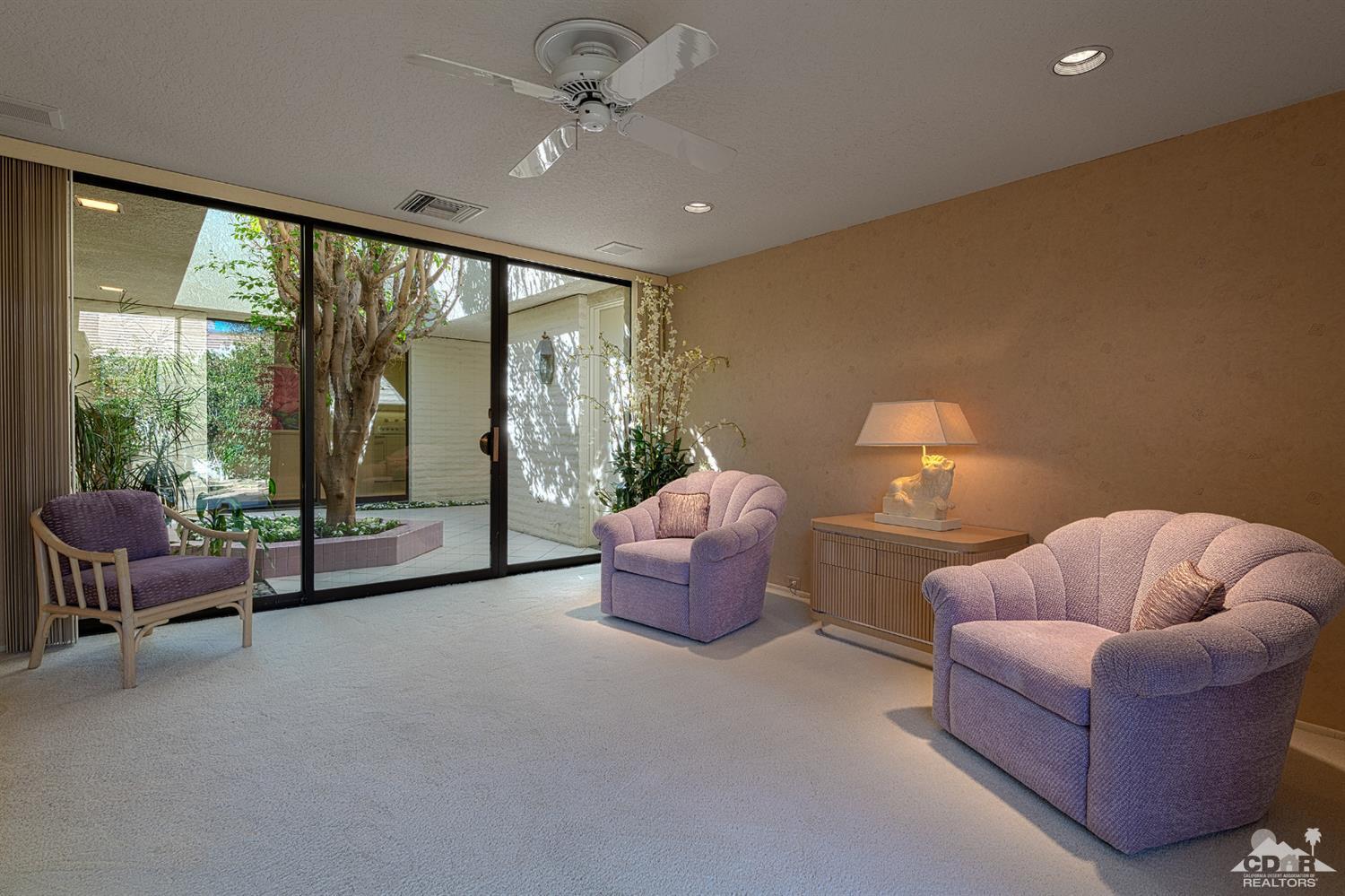 24 Johnar Boulevard Rancho Mirage, CA 92270 - Photo 15 of 26 a living room with furniture and a large window