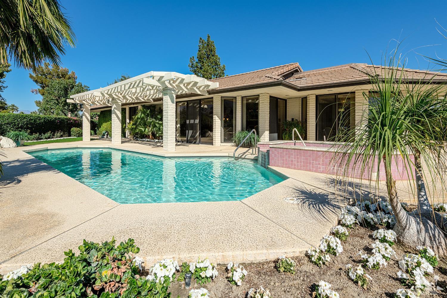 24 Johnar Boulevard Rancho Mirage, CA 92270 - Photo 16 of 26 front view of a house with a yard