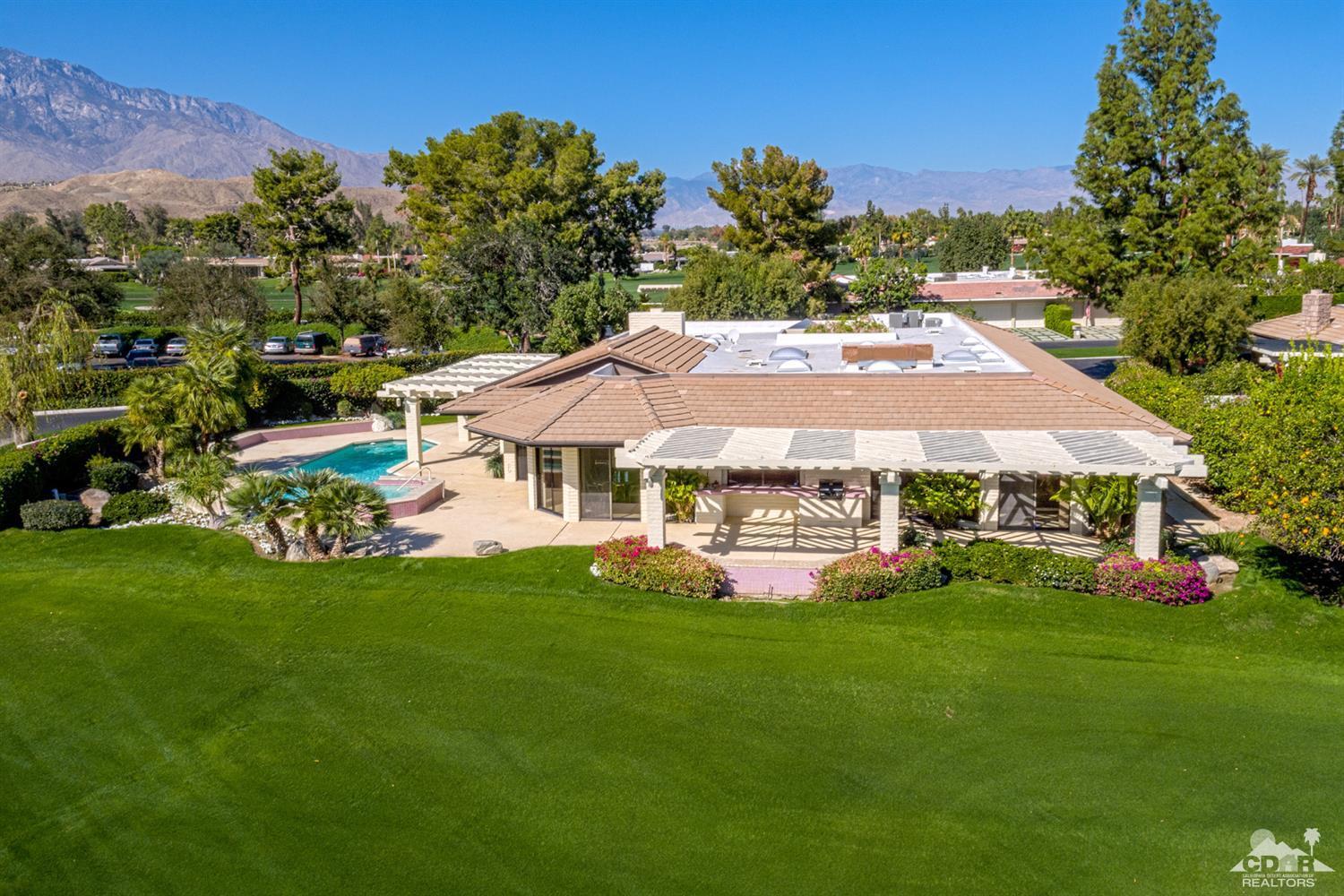 24 Johnar Boulevard Rancho Mirage, CA 92270 - Photo 20 of 26 a front view of a house with garden
