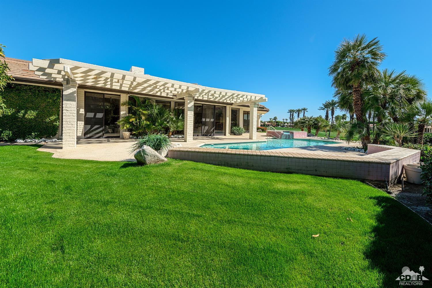 24 Johnar Boulevard Rancho Mirage, CA 92270 - Photo 3 of 26 a view of a house with a backyard porch and sitting area
