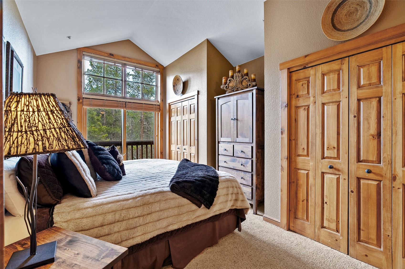 57 Lake Ridge Circle, Unit 1848 Keystone, CO 80435 - Photo 18 of 49 a bedroom with a bed a window and walk in closet