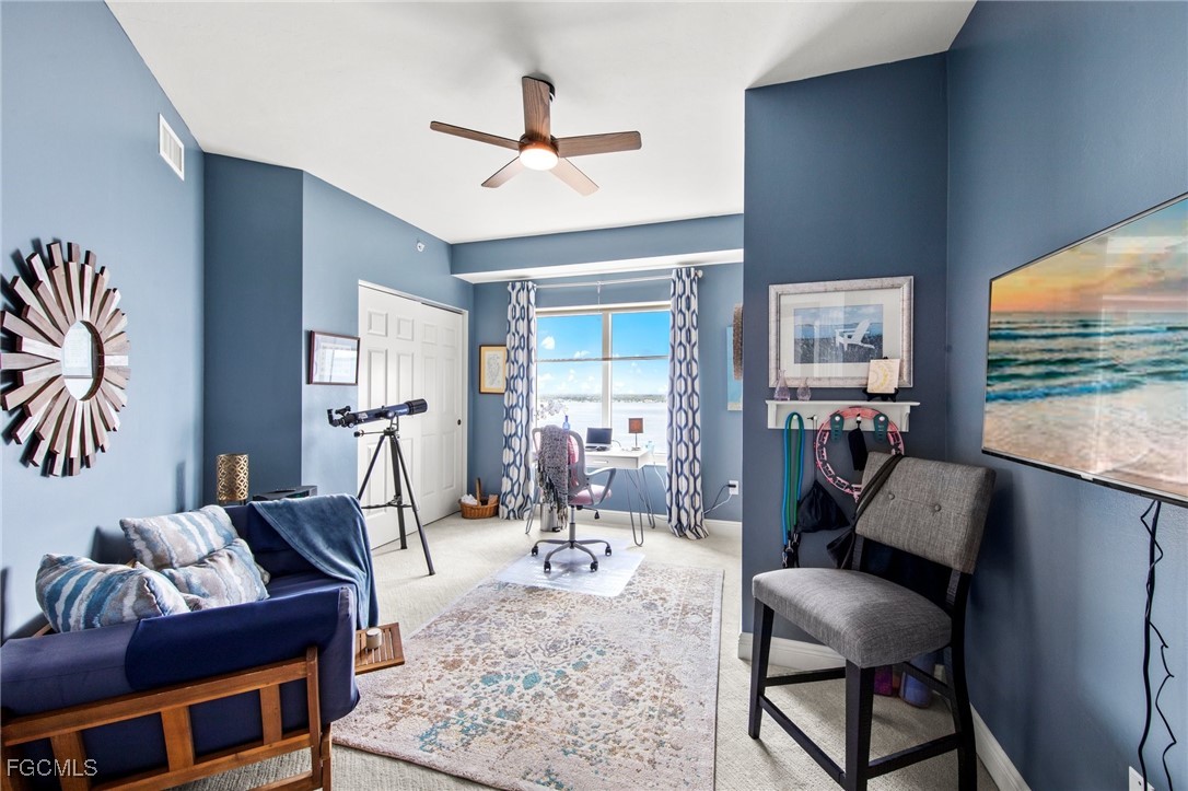 2745 First Street, Unit 1602 Fort Myers, FL 33916 - Photo 22 of 49 a living room with furniture and a large window