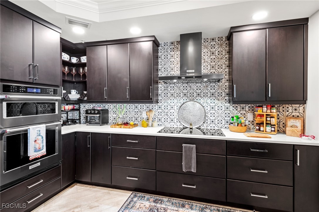 2745 First Street, Unit 1602 Fort Myers, FL 33916 - Photo 8 of 49 a kitchen with a sink and stainless steel appliances