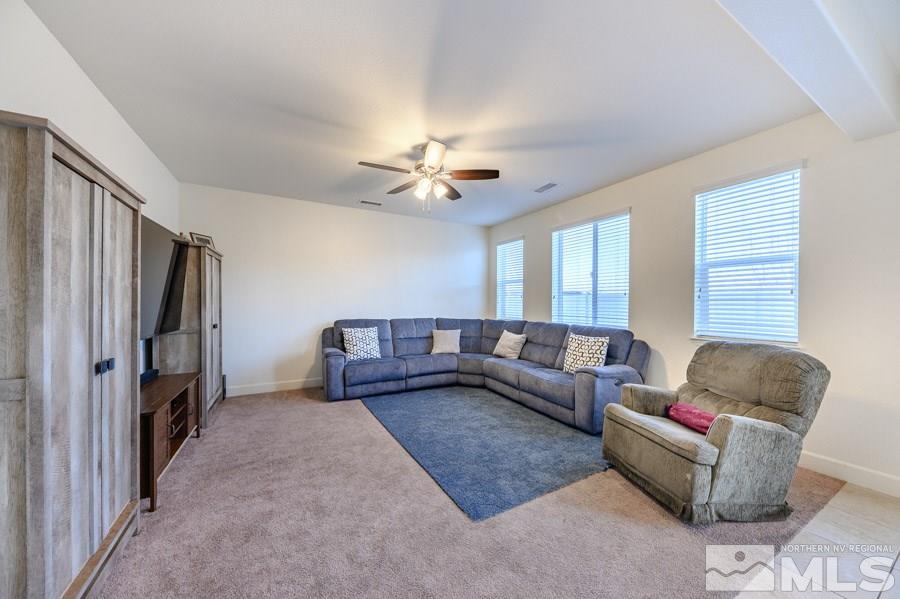 10062 Ignacio Circle Reno, NV 89521 - Photo 3 of 18 a living room with furniture and a window