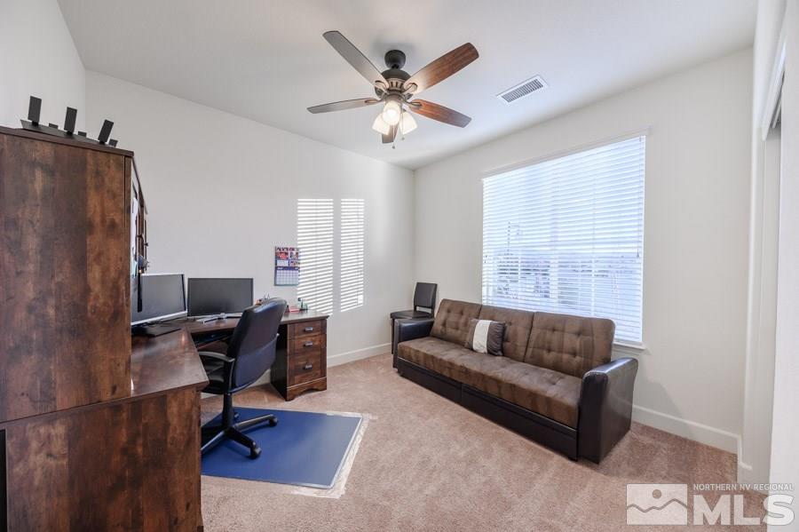 10062 Ignacio Circle Reno, NV 89521 - Photo 6 of 18 a living room with furniture and a window