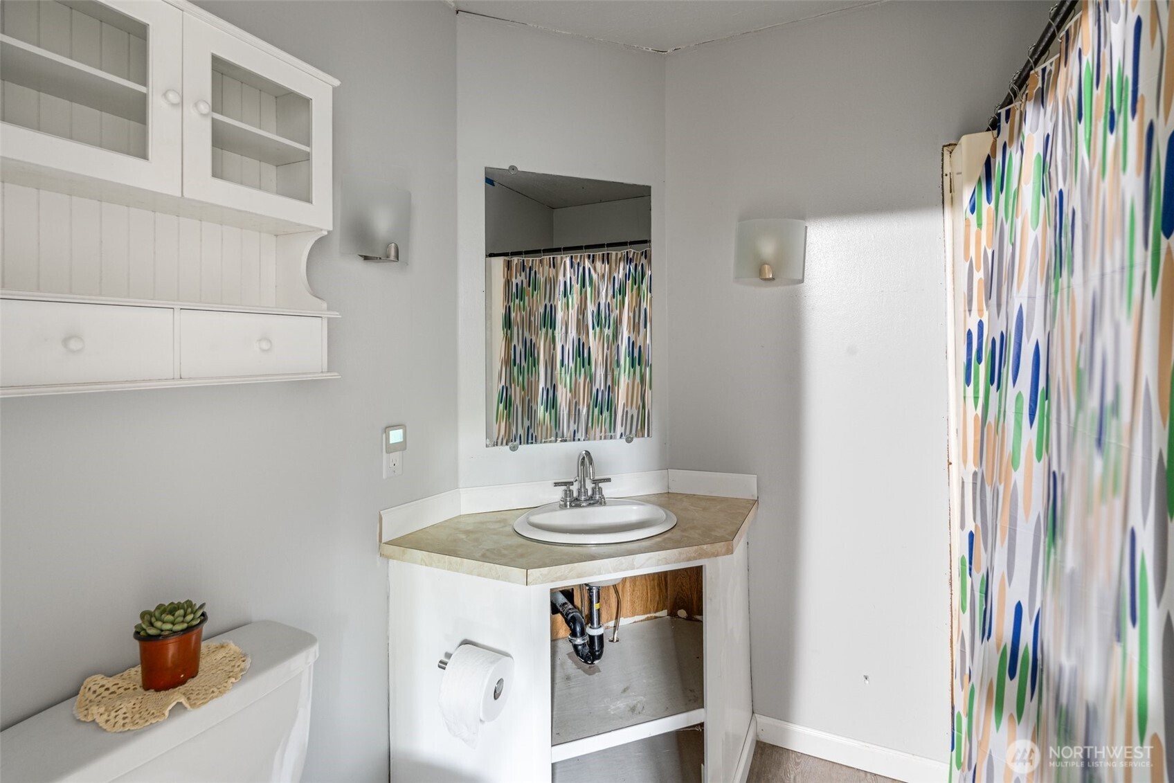8510 Martin Way East, Unit 25 Lacey, WA 98516 - Photo 16 of 26 a bathroom with a sink and a mirror