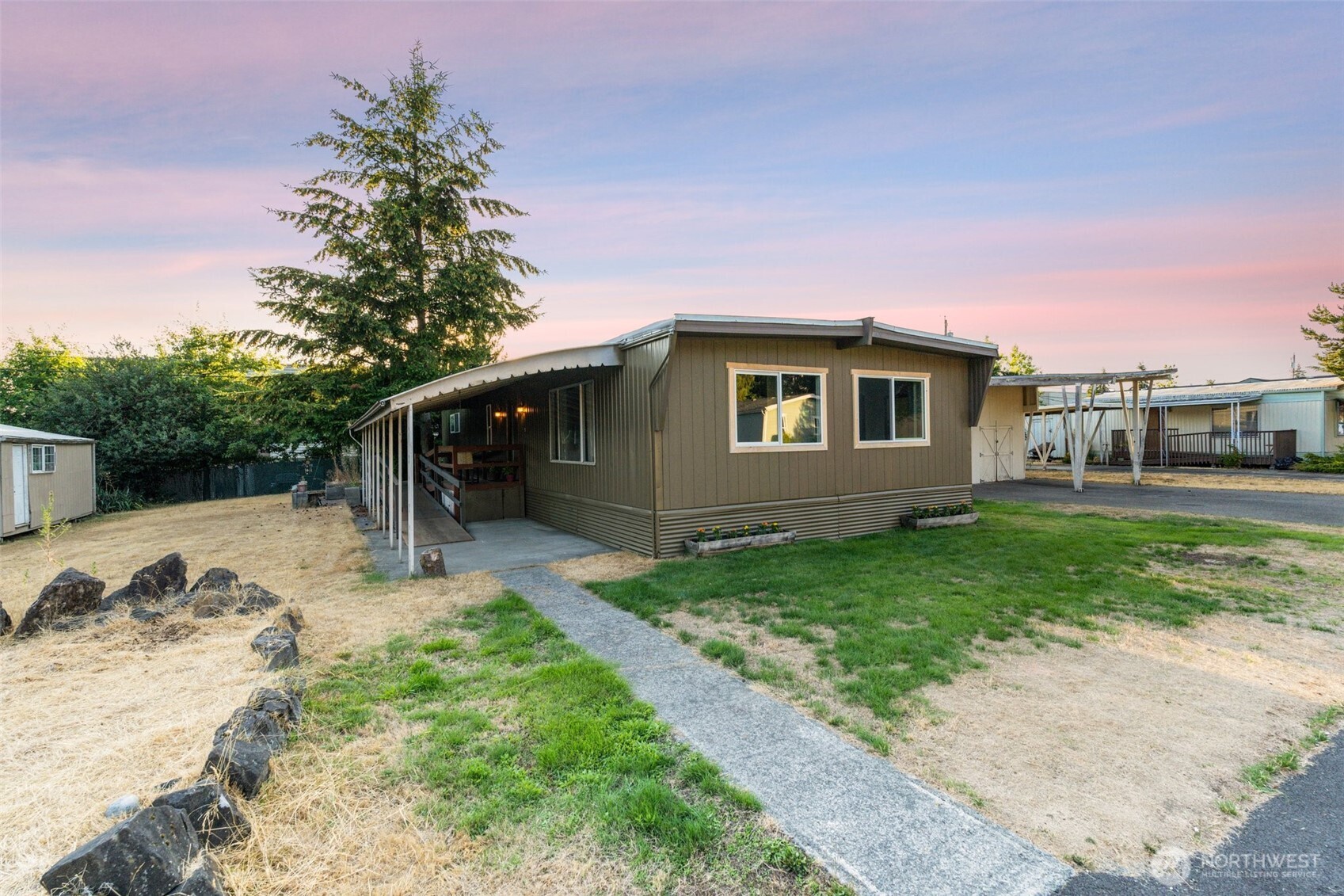 8510 Martin Way East, Unit 25 Lacey, WA 98516 - Photo 19 of 26 a front view of a house with a yard