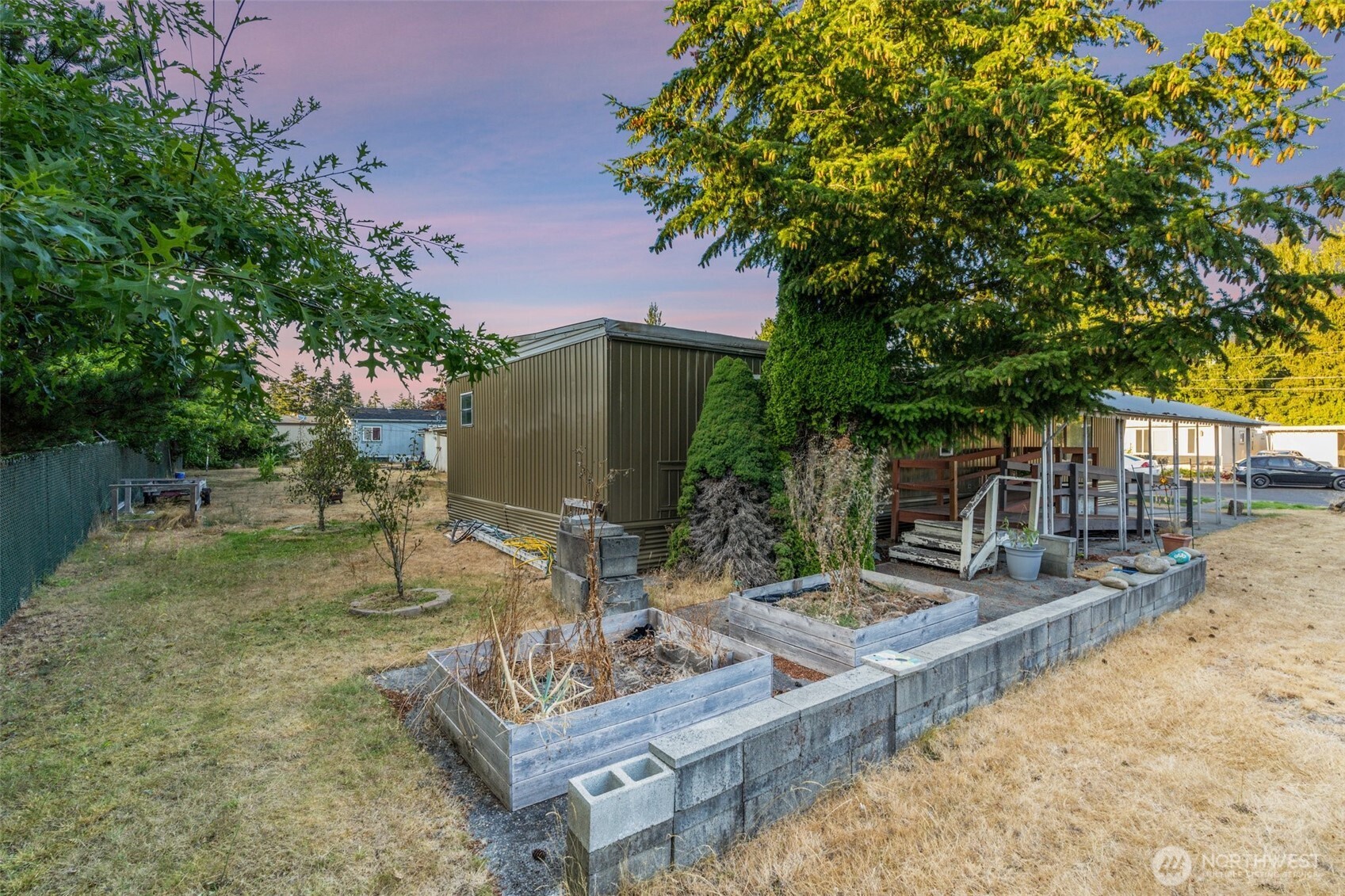 8510 Martin Way East, Unit 25 Lacey, WA 98516 - Photo 21 of 26 a view of backyard with a table and chairs
