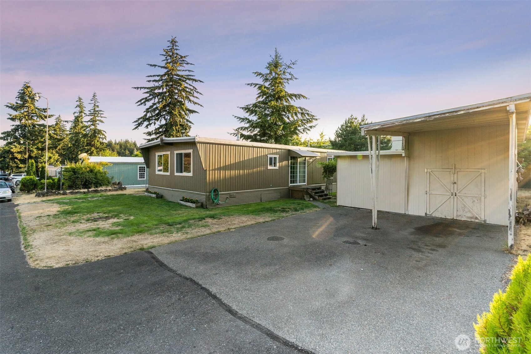 8510 Martin Way East, Unit 25 Lacey, WA 98516 - Photo 25 of 26 a view of a house with a yard and potted plants