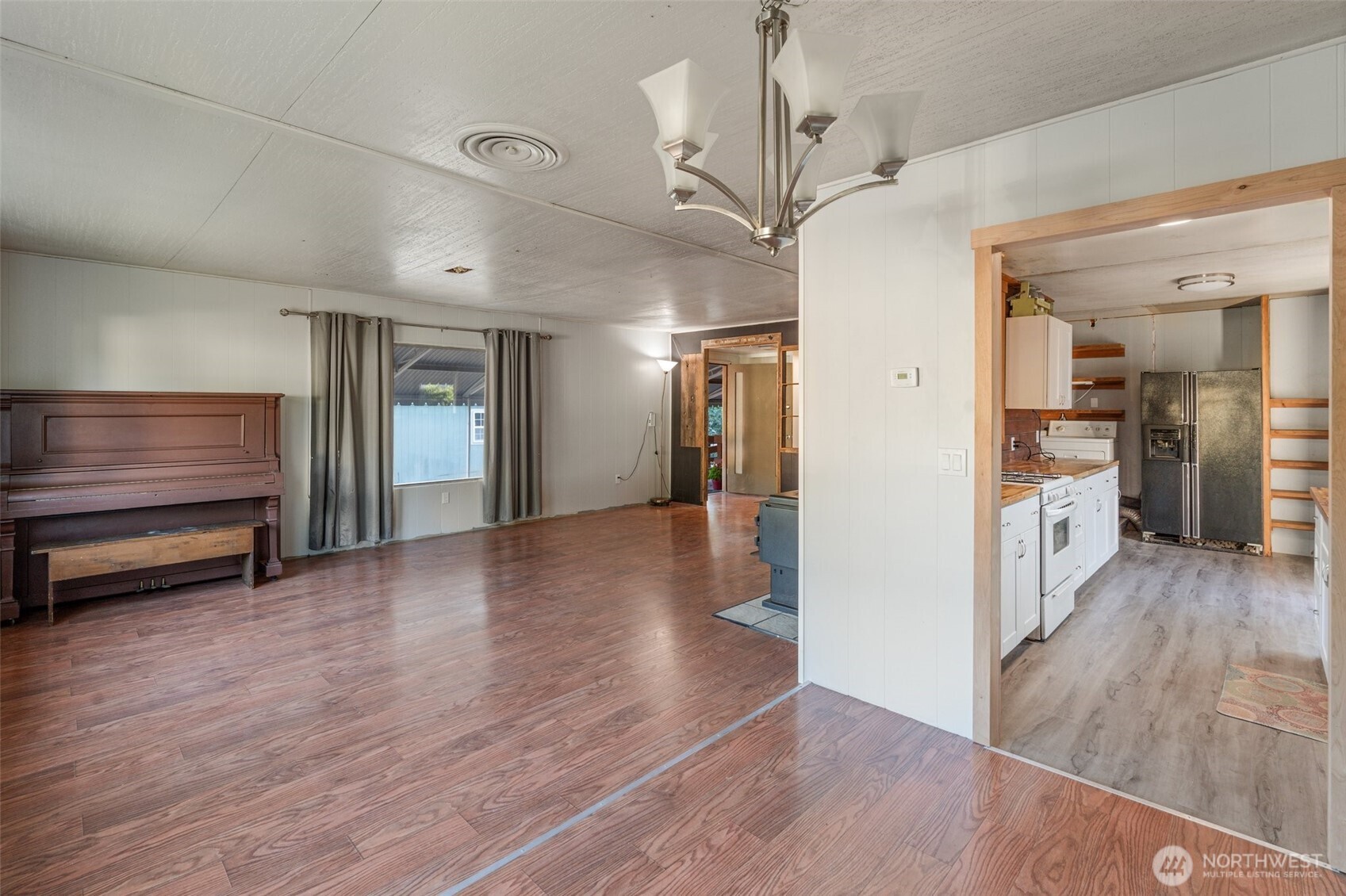 8510 Martin Way East, Unit 25 Lacey, WA 98516 - Photo 6 of 26 a view of a room with wooden floor and windows