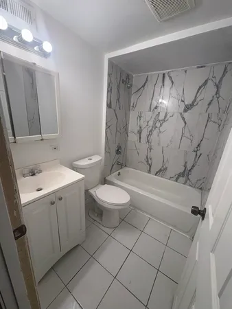 a kitchen with a sink and a refrigerator