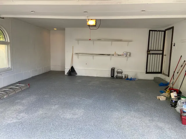 a view of a livingroom with furniture and a window