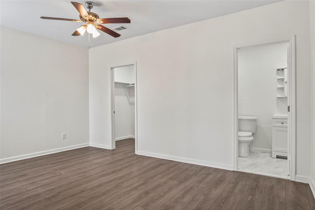 442 West McCart Street Krum, TX 76249 - Photo 15 of 40 wooden floor in an empty room