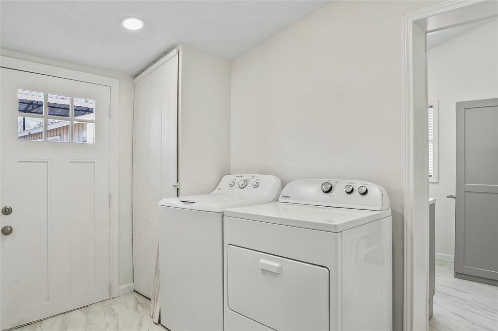 442 West McCart Street Krum, TX 76249 - Photo 25 of 40 a utility room with dryer and washer