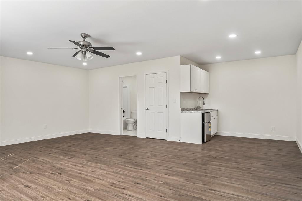 442 West McCart Street Krum, TX 76249 - Photo 30 of 40 a view of a kitchen with a sink and a refrigerator