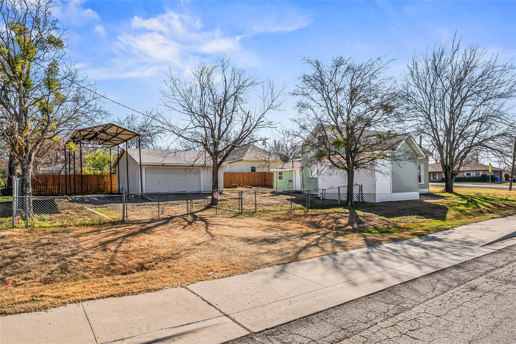 442 West McCart Street Krum, TX 76249 - Photo 40 of 40 a view of a yard with snow on the road