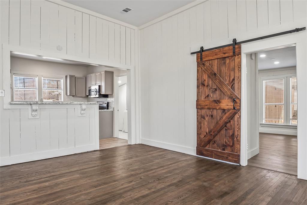442 West McCart Street Krum, TX 76249 - Photo 10 of 40 a view of a kitchen with wooden floor and a kitchen