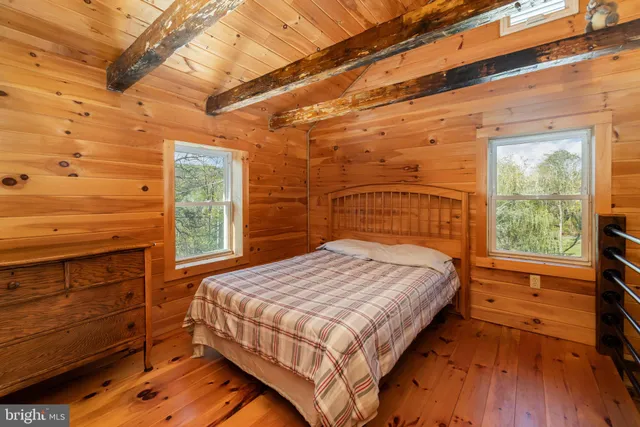 a bed sitting in a bedroom next to a building
