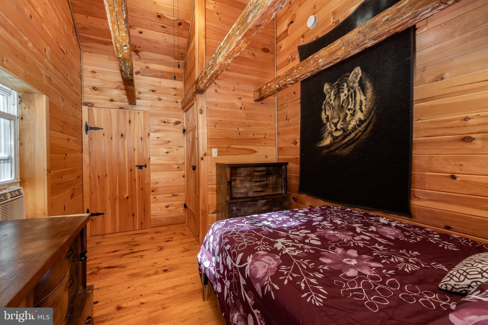 1180 Campbell Hollow Road East Waterford, PA 17021 - Photo 14 of 51 a bedroom with a bed and a dresser