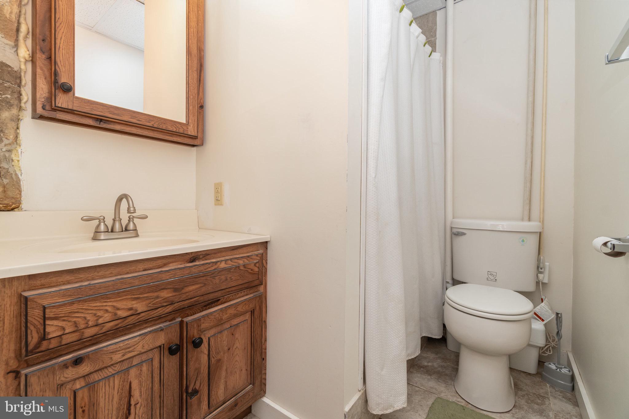 1180 Campbell Hollow Road East Waterford, PA 17021 - Photo 18 of 51 a view of a sink and a toilet