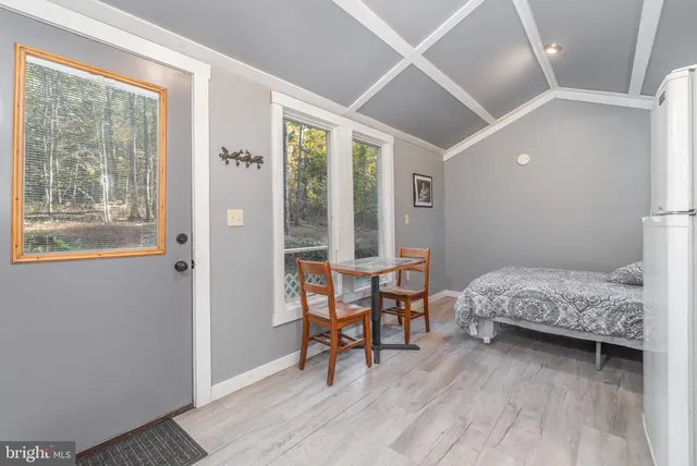 a room with a window and a mirror