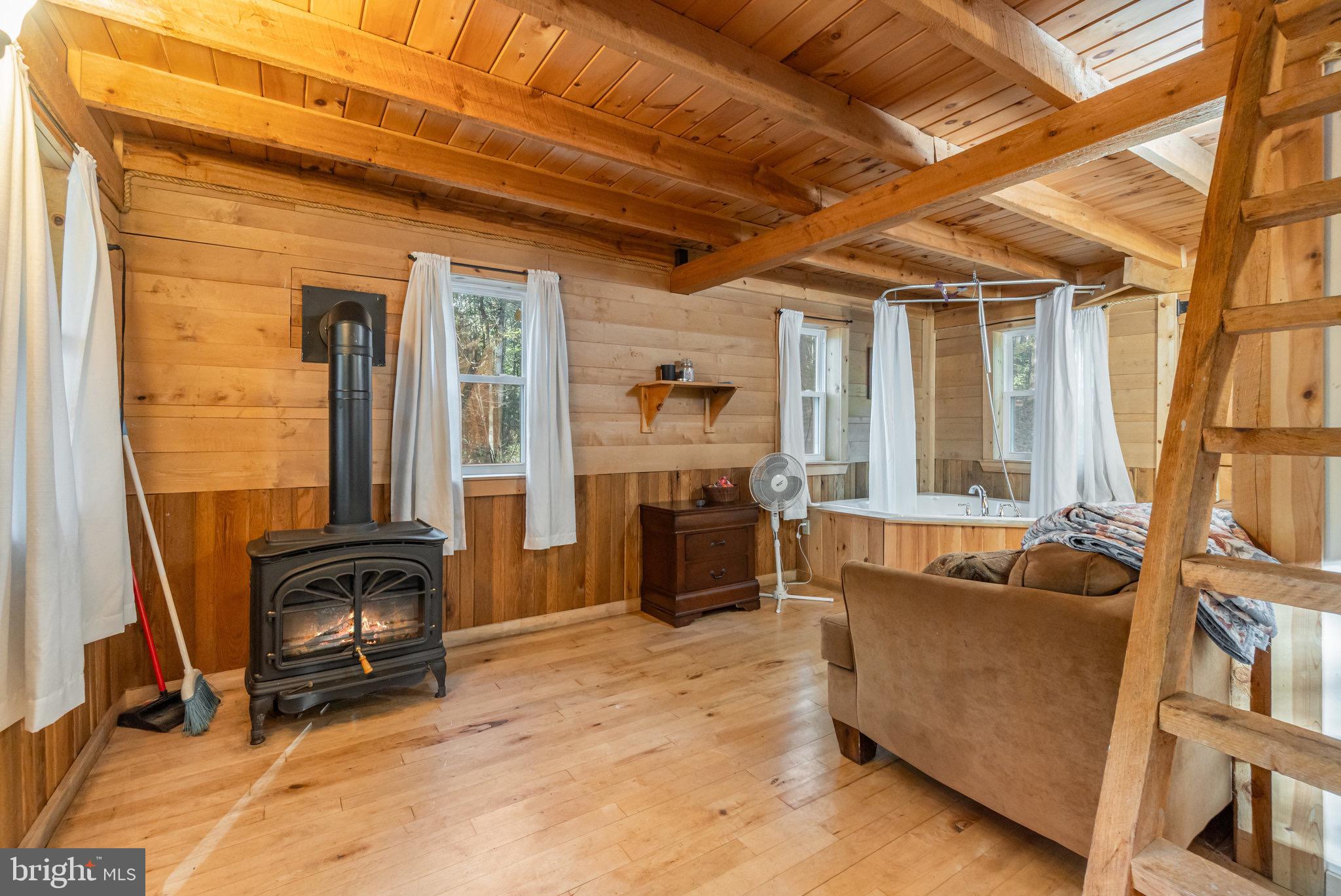 1180 Campbell Hollow Road East Waterford, PA 17021 - Photo 30 of 51 a living room with furniture and a couch