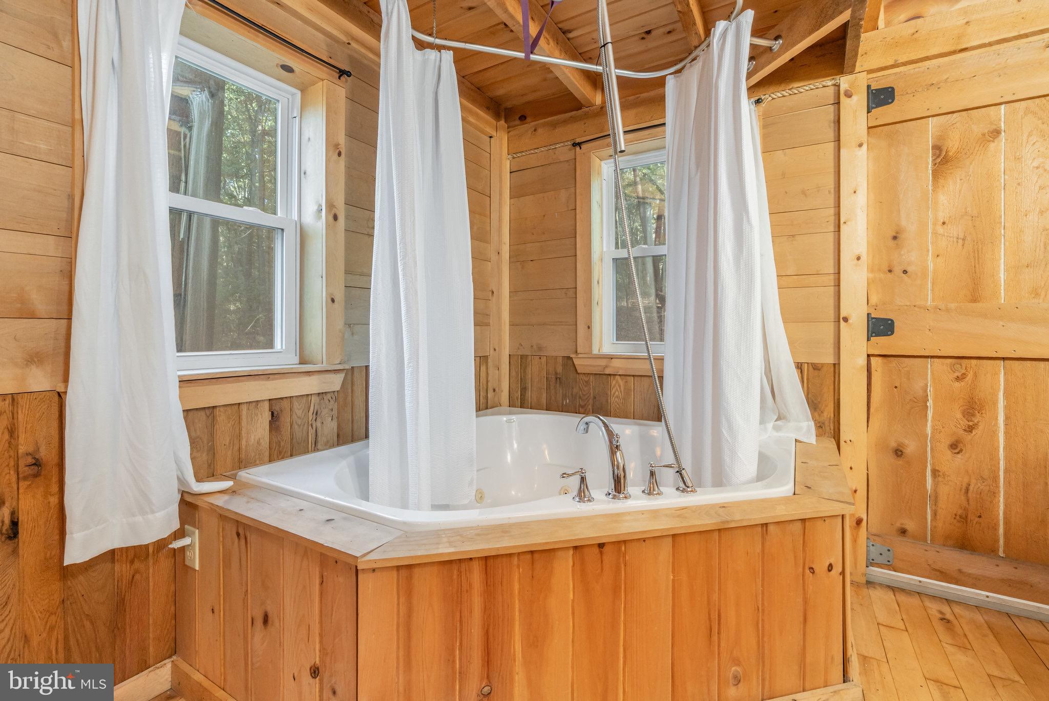 1180 Campbell Hollow Road East Waterford, PA 17021 - Photo 32 of 51 a bathroom with a sink and a bathtub