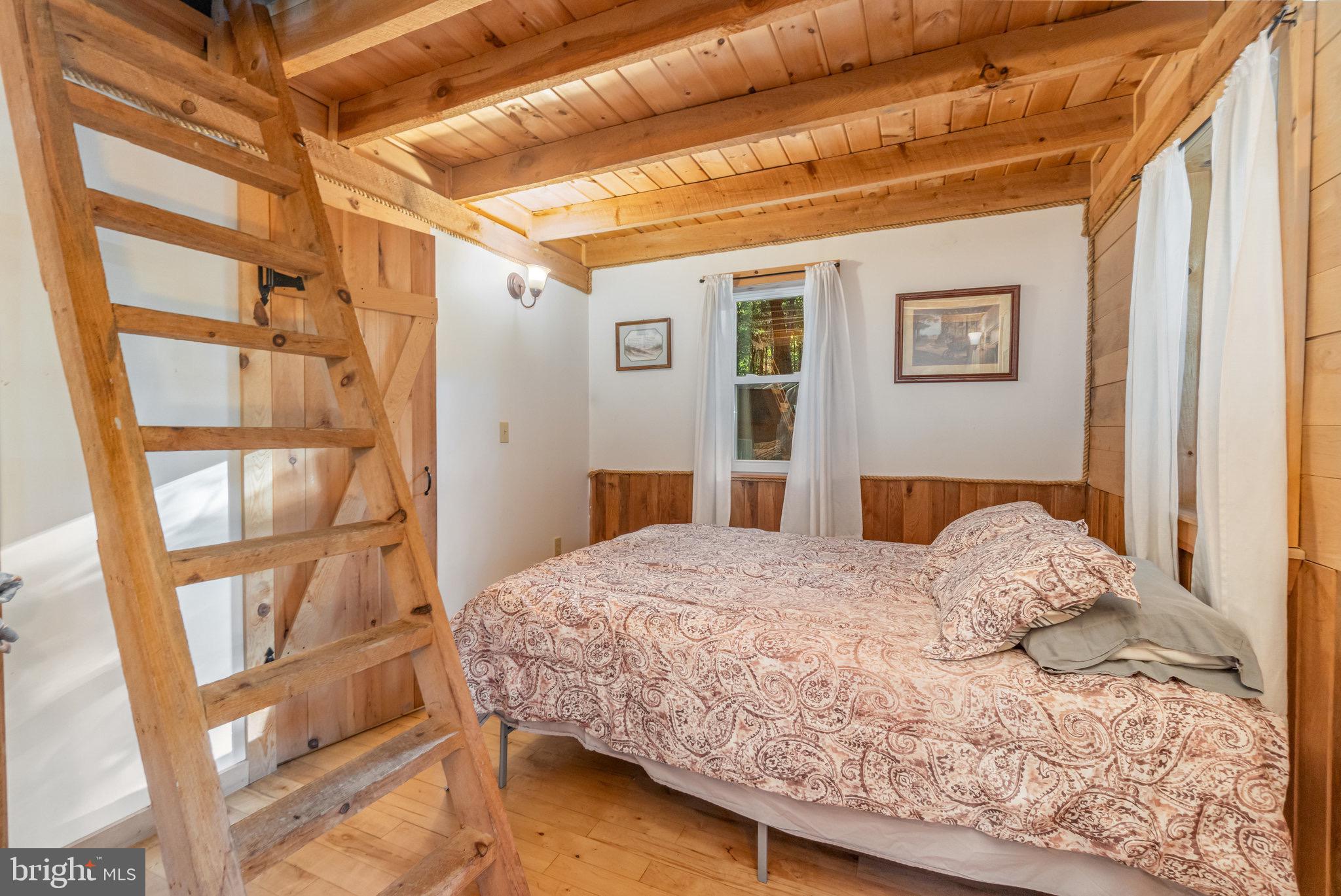 1180 Campbell Hollow Road East Waterford, PA 17021 - Photo 34 of 51 a bedroom with a bed and a window