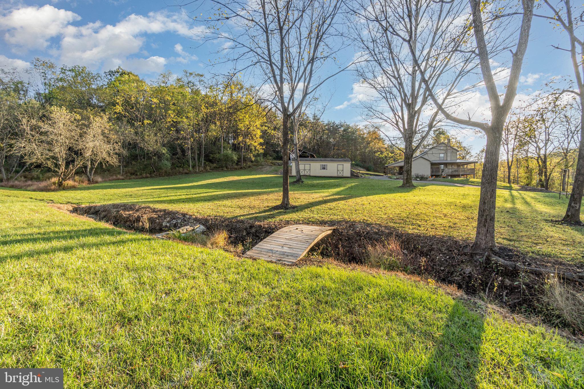 1180 Campbell Hollow Road East Waterford, PA 17021 - Photo 40 of 51 a view of a yard with swimming pool and trees