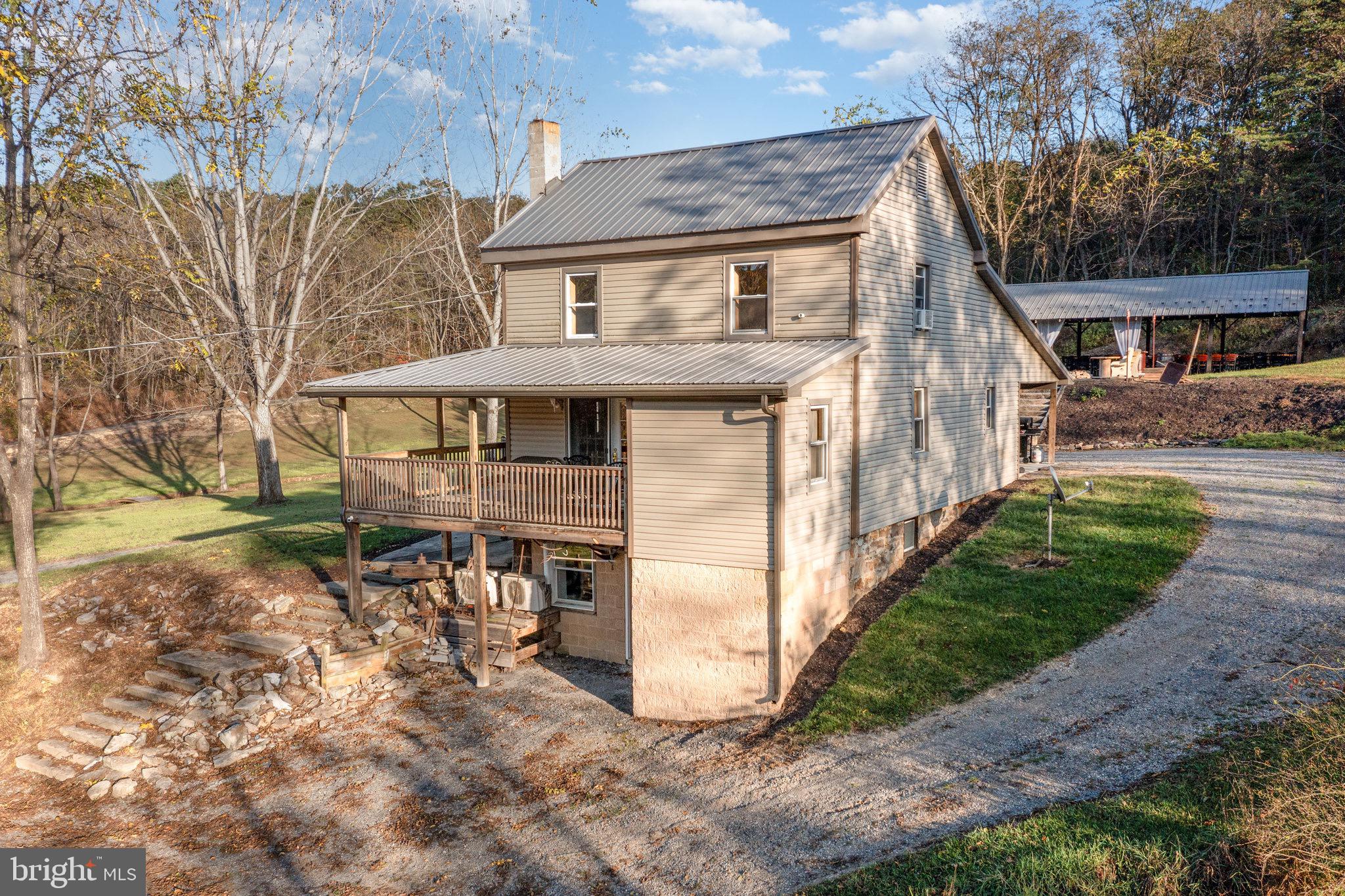 1180 Campbell Hollow Road East Waterford, PA 17021 - Photo 42 of 51 a view of a house with a yard