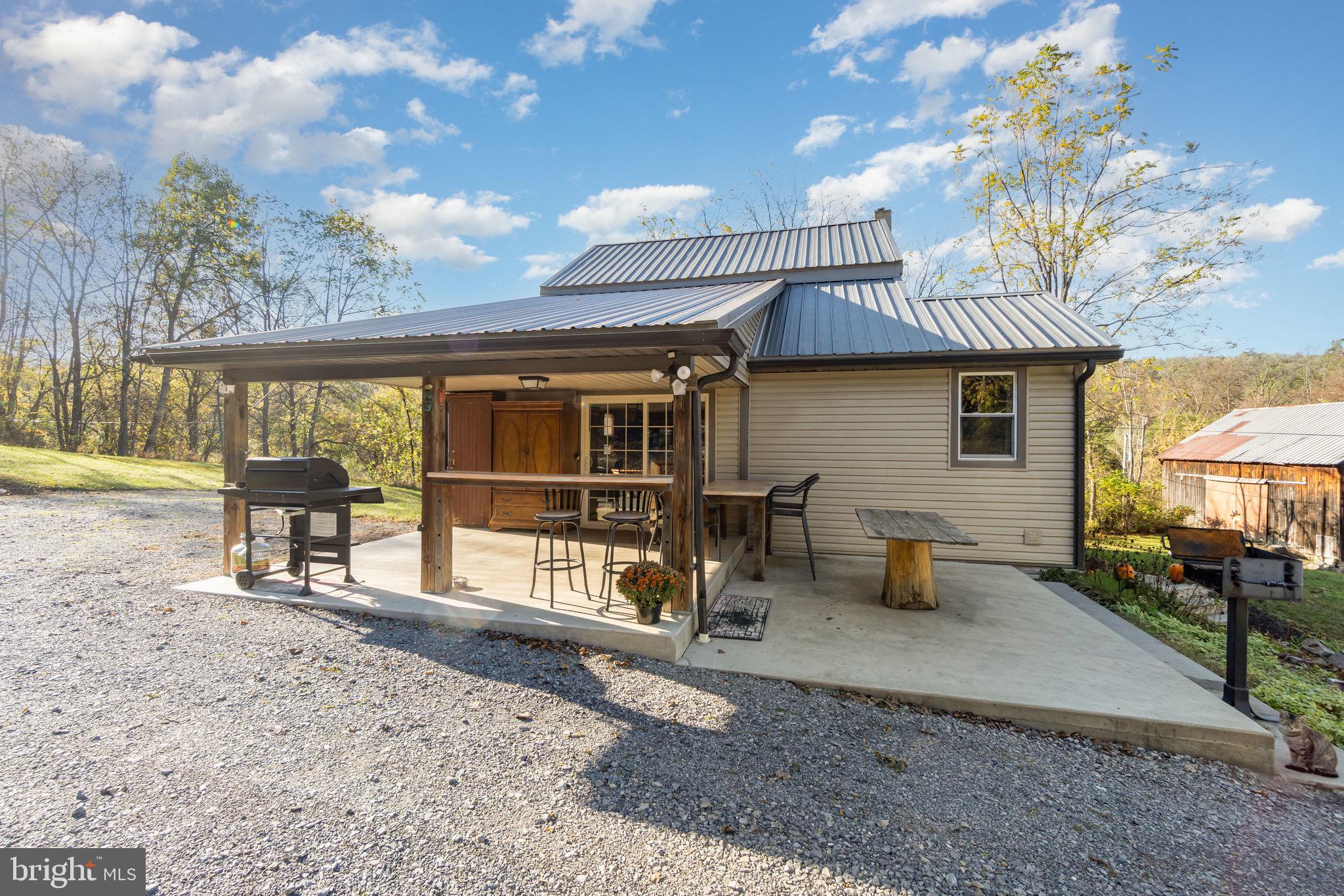 1180 Campbell Hollow Road East Waterford, PA 17021 - Photo 43 of 51 a view of a house with backyard and sitting area