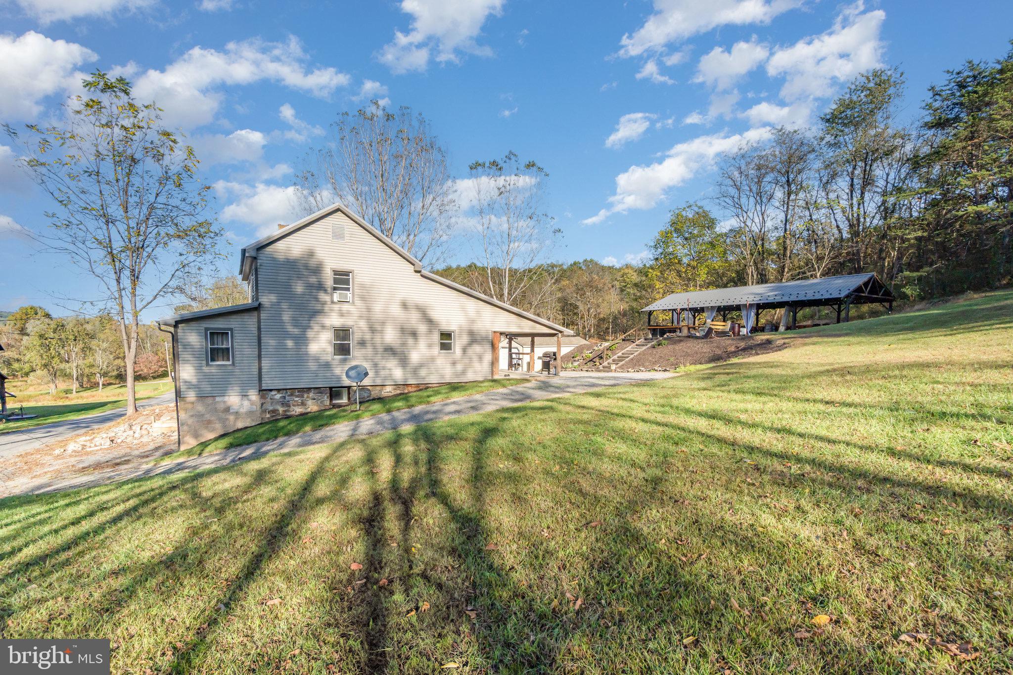 1180 Campbell Hollow Road East Waterford, PA 17021 - Photo 44 of 51 a view of an house with swimming pool