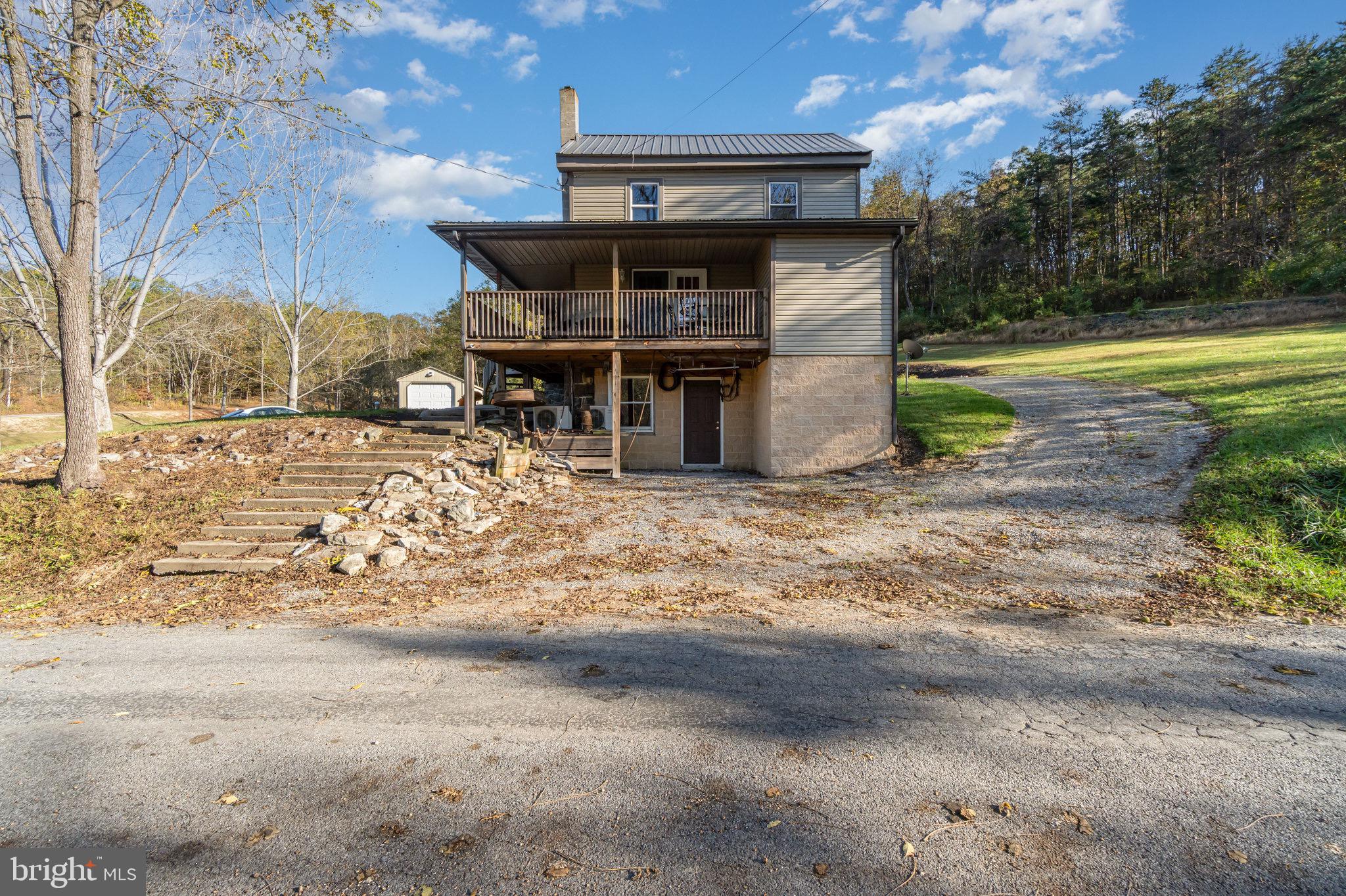1180 Campbell Hollow Road East Waterford, PA 17021 - Photo 45 of 51 a front view of a house with a yard
