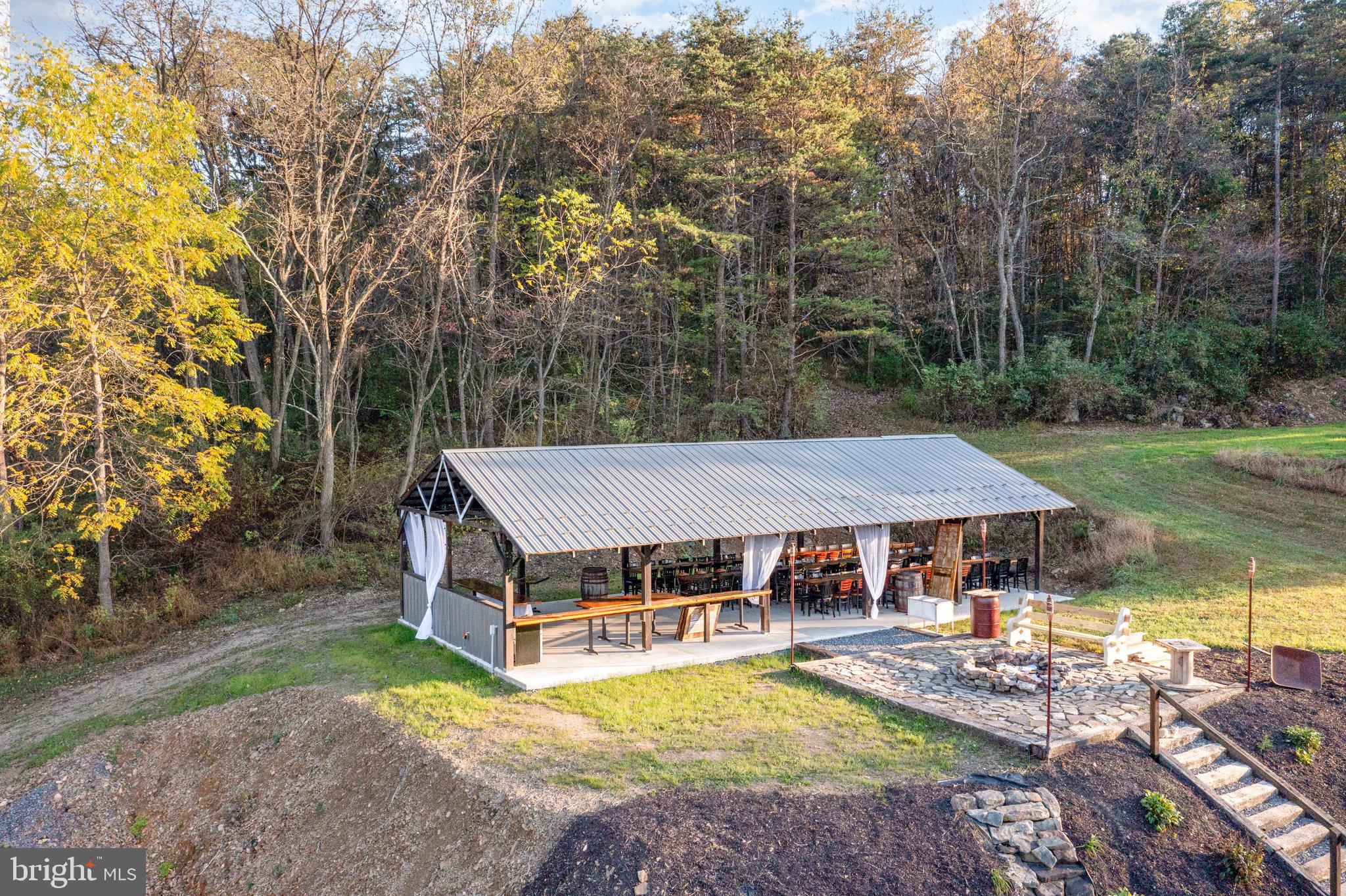 1180 Campbell Hollow Road East Waterford, PA 17021 - Photo 46 of 51 an aerial view of a house with swimming pool table and chairs