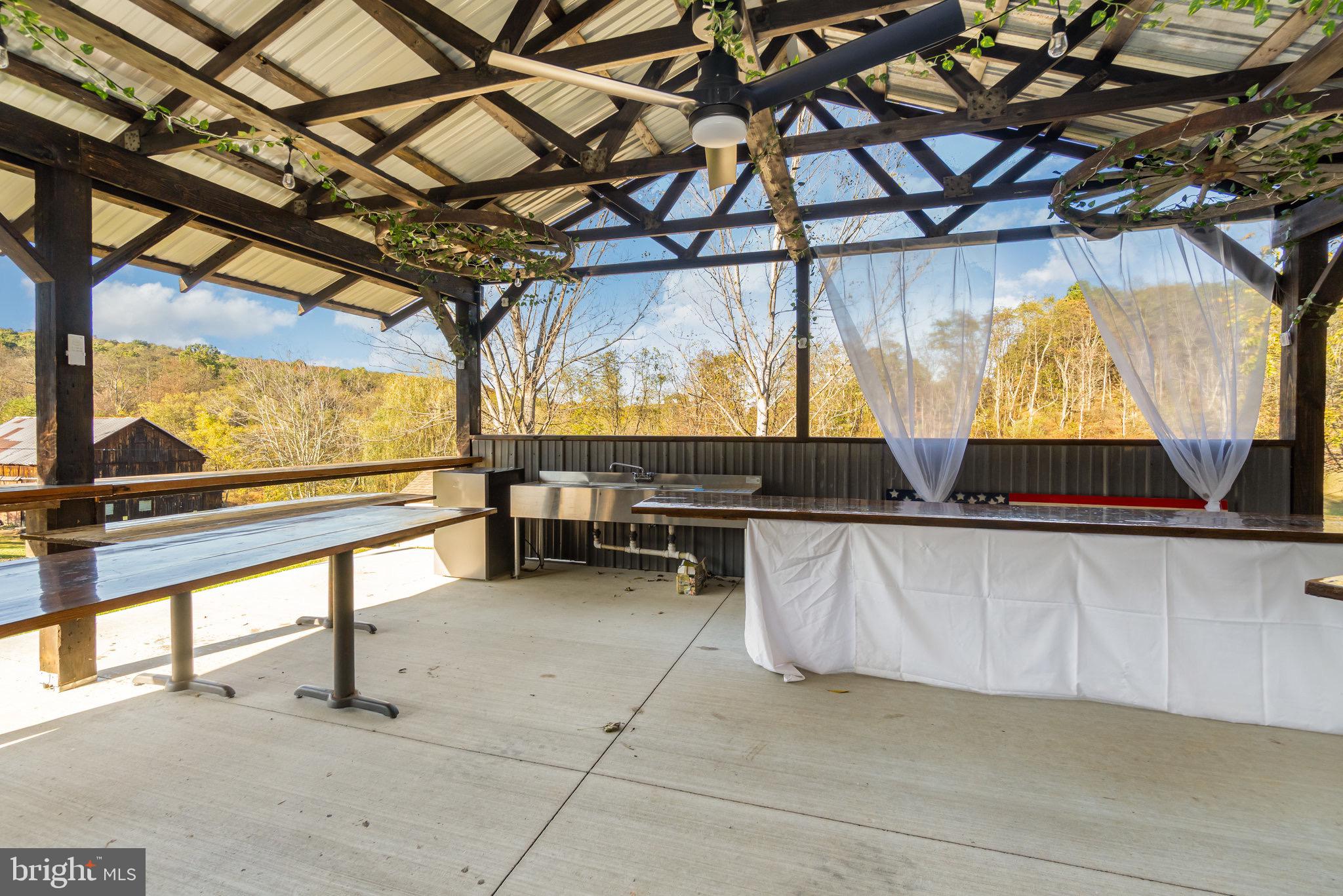 1180 Campbell Hollow Road East Waterford, PA 17021 - Photo 49 of 51 a living room with a table and chairs