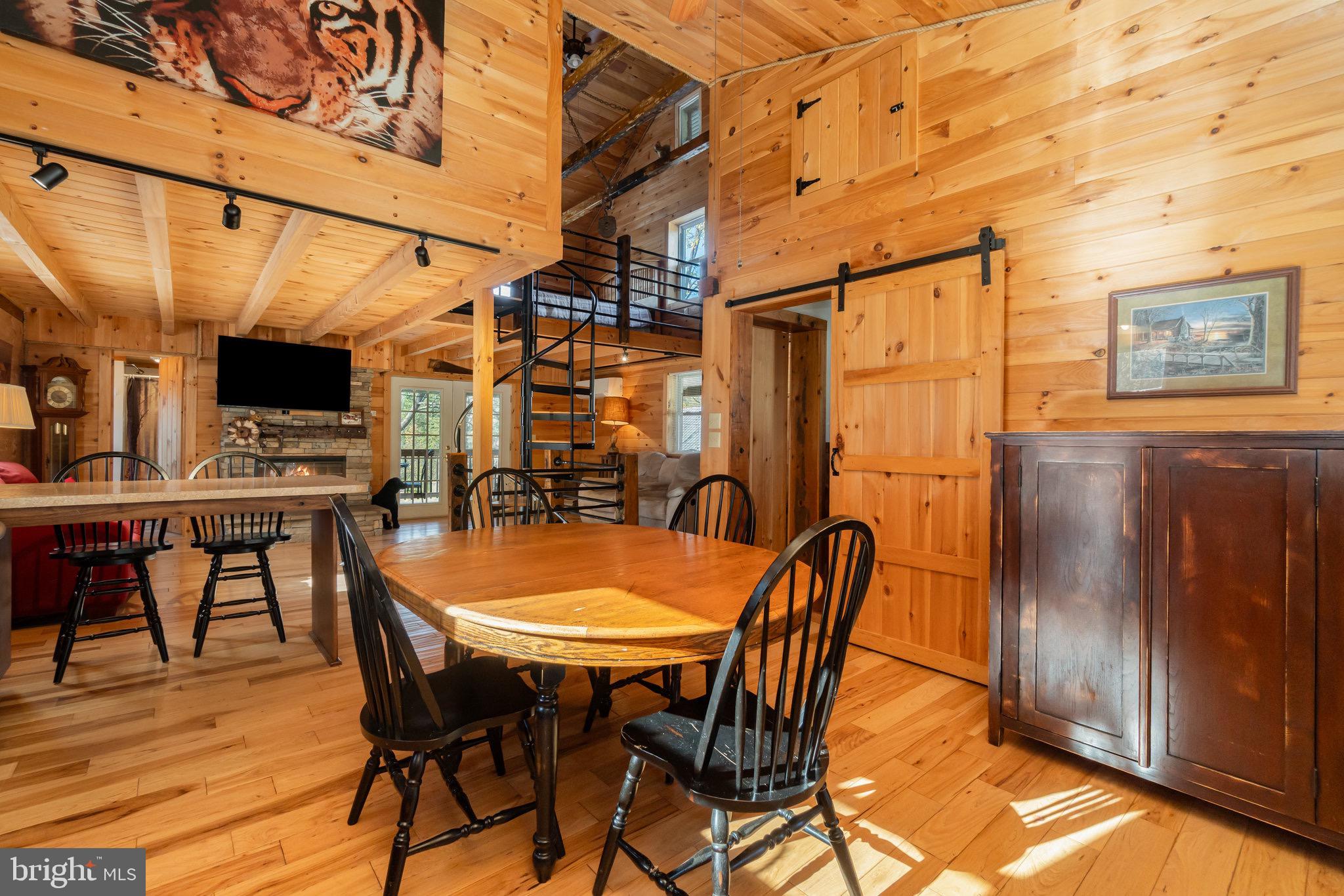 1180 Campbell Hollow Road East Waterford, PA 17021 - Photo 7 of 51 a view of a dining room with furniture and wooden floor