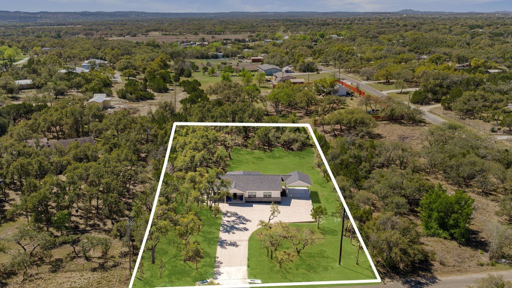 408 Rust Ranch Road Blanco, TX 78606 - Photo 33 of 35 Aerial view of property and surrounding area featuring a heavily wooded area and property boundaries highlighted