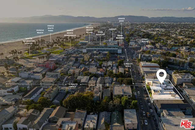 an aerial view of a city with ocean view
