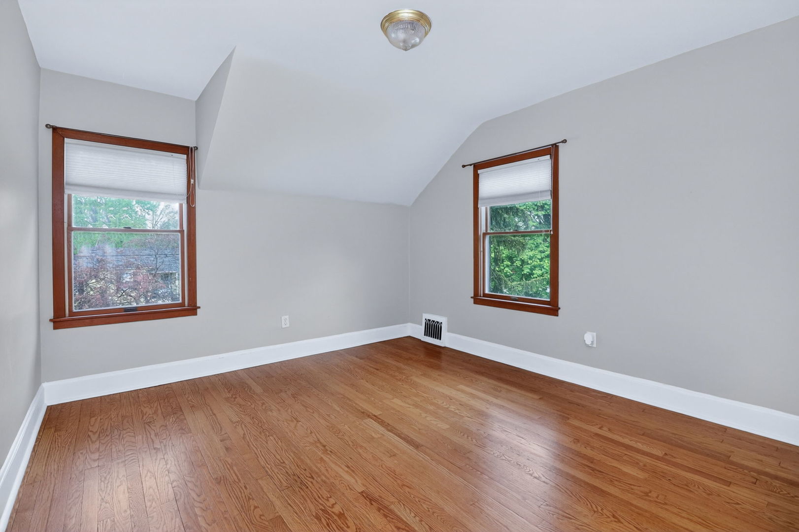 32W183 Glos Street Wayne, IL 60184 - Photo 17 of 30 an empty room with wooden floor and windows