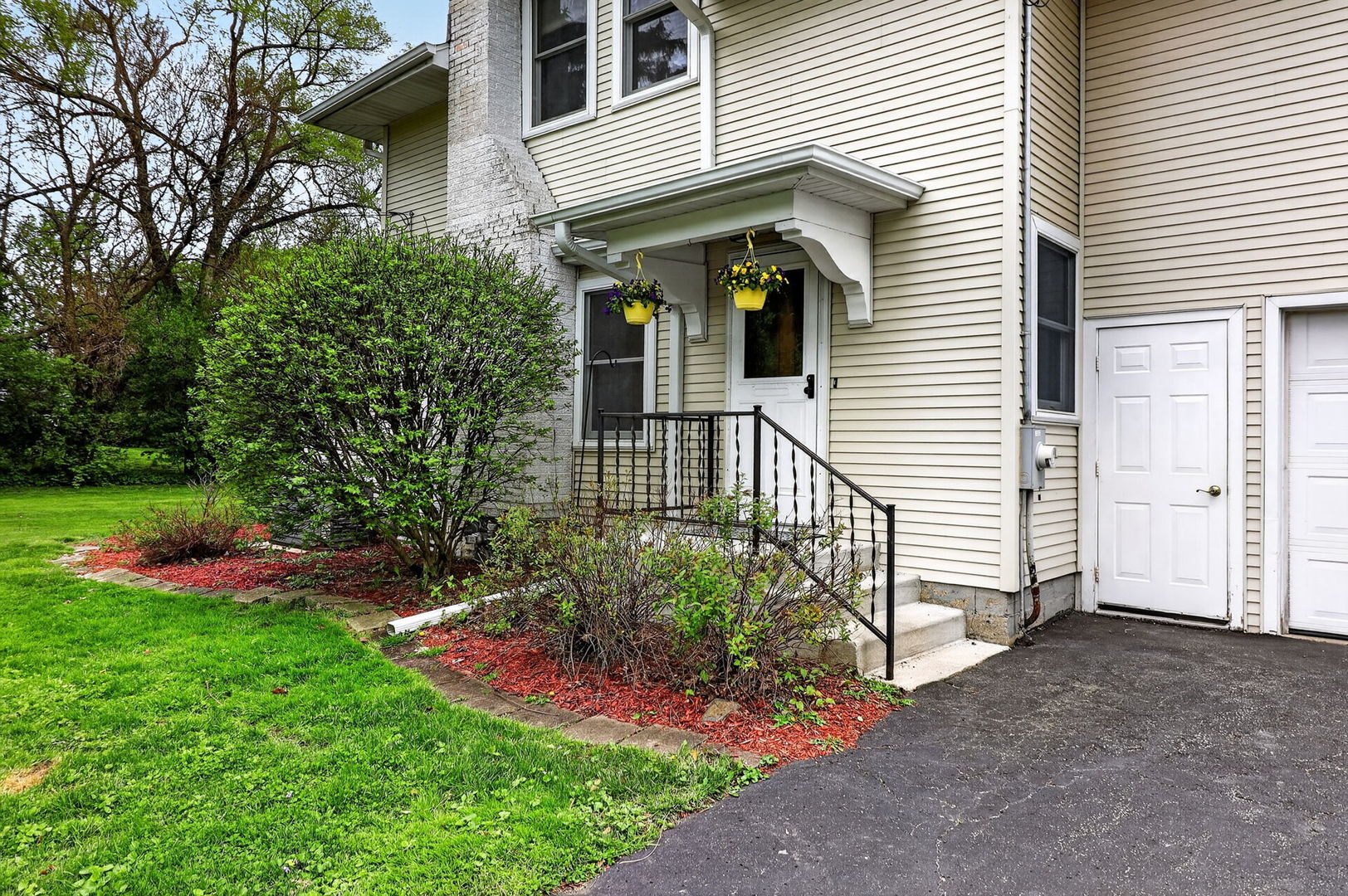 32W183 Glos Street Wayne, IL 60184 - Photo 2 of 30 a view of a house with a yard and potted plants