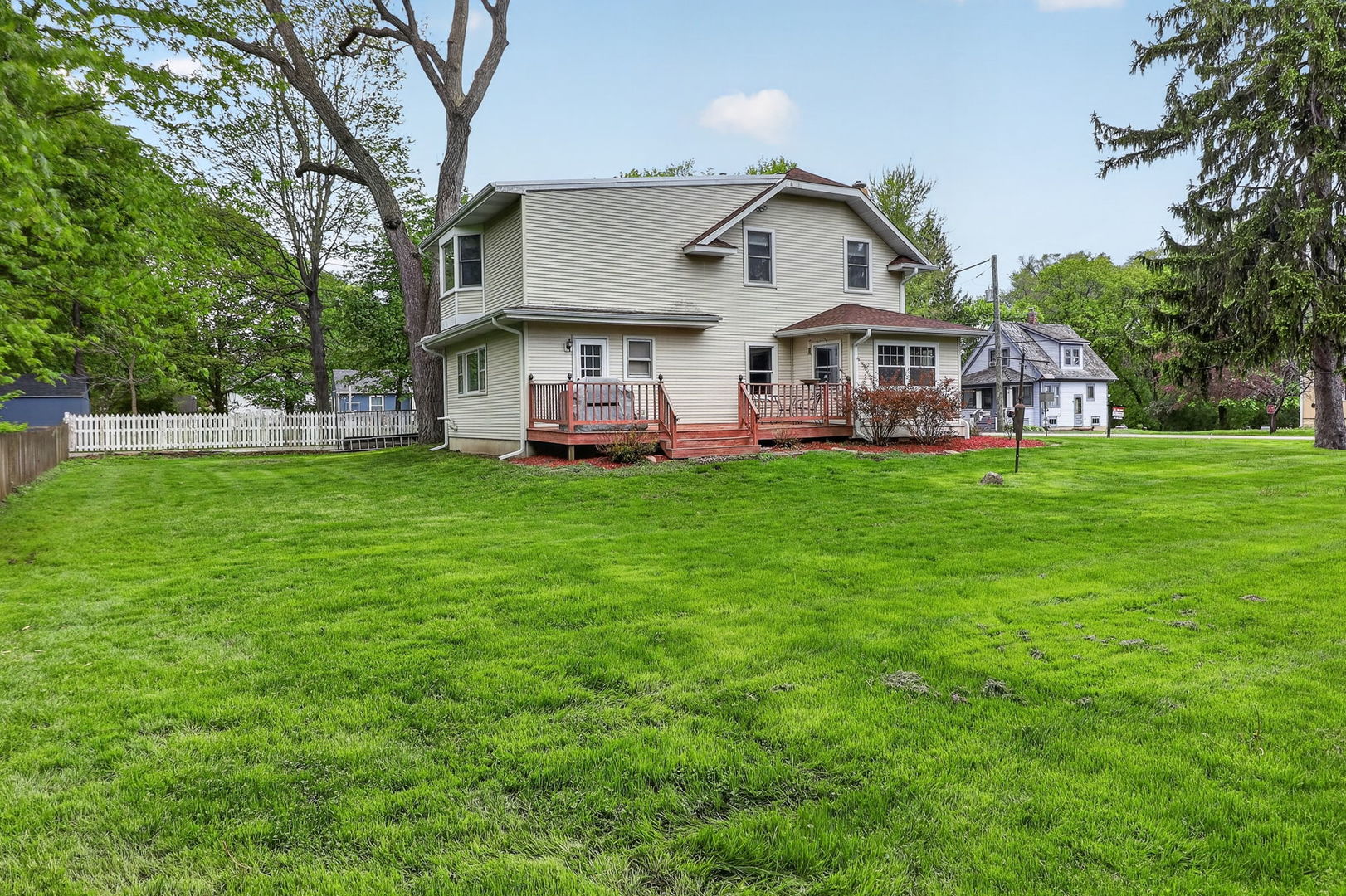 32W183 Glos Street Wayne, IL 60184 - Photo 27 of 30 a view of a house with a yard and sitting area