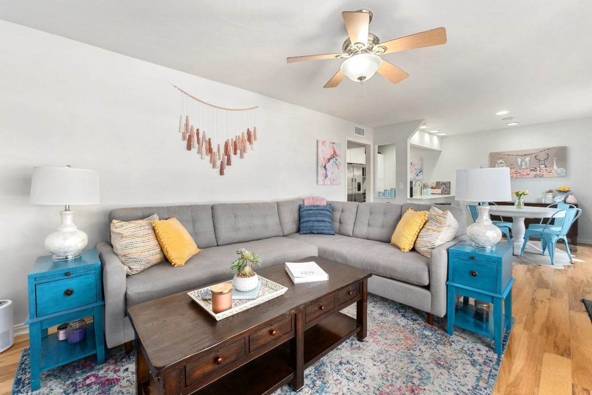 1210 Windsor Road, Unit 122 Austin, TX 78703 - Photo 1 of 24 Living room featuring light wood-type flooring and a ceiling fan