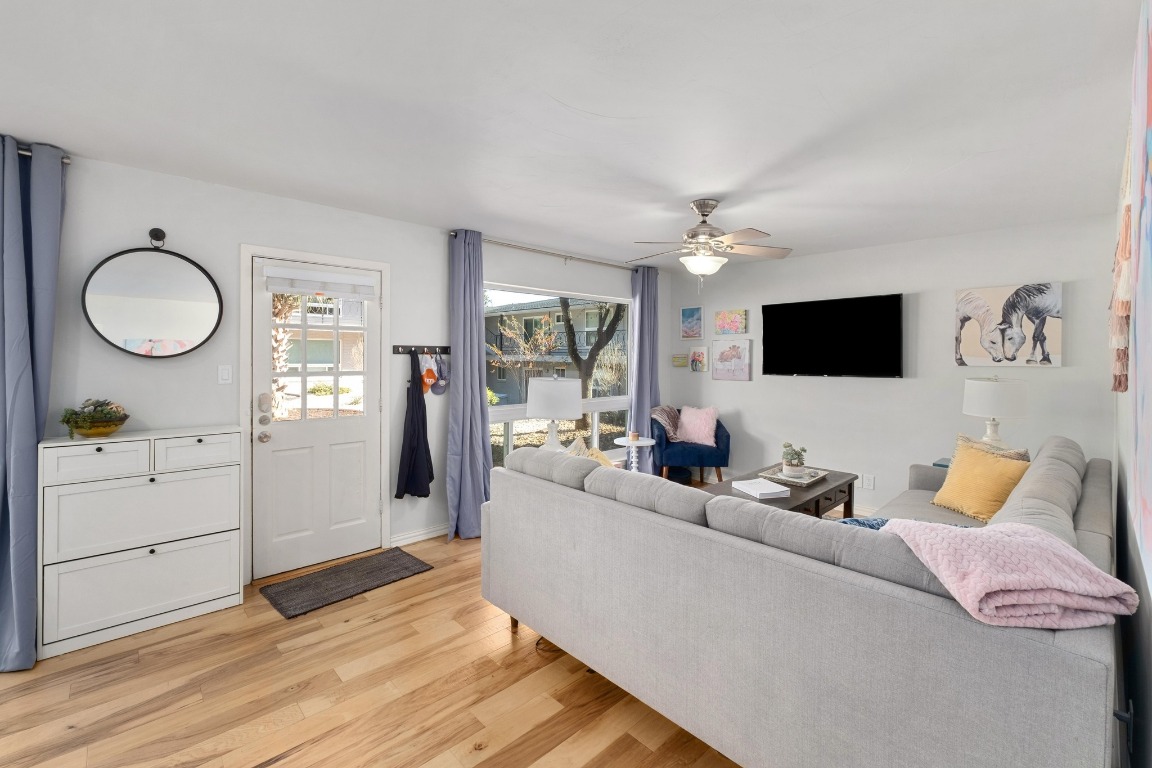 1210 Windsor Road, Unit 122 Austin, TX 78703 - Photo 6 of 24 Living area with light wood-style flooring and ceiling fan