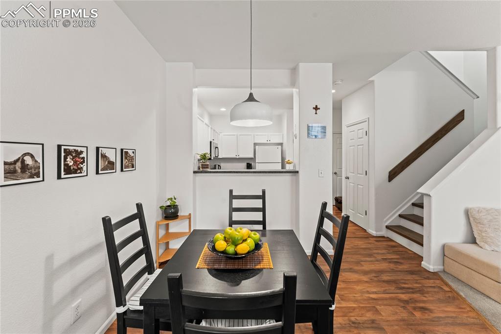 7362 Sandy Springs Point Fountain, CO 80817 - Photo 11 of 41 a view of a dining room with furniture and wooden floor