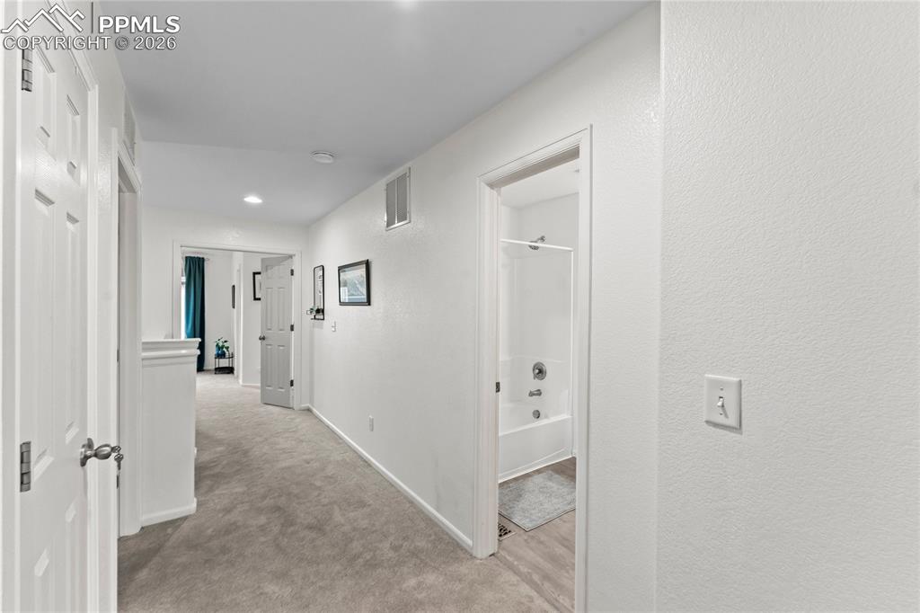 7362 Sandy Springs Point Fountain, CO 80817 - Photo 21 of 41 a view of a hallway with two rooms