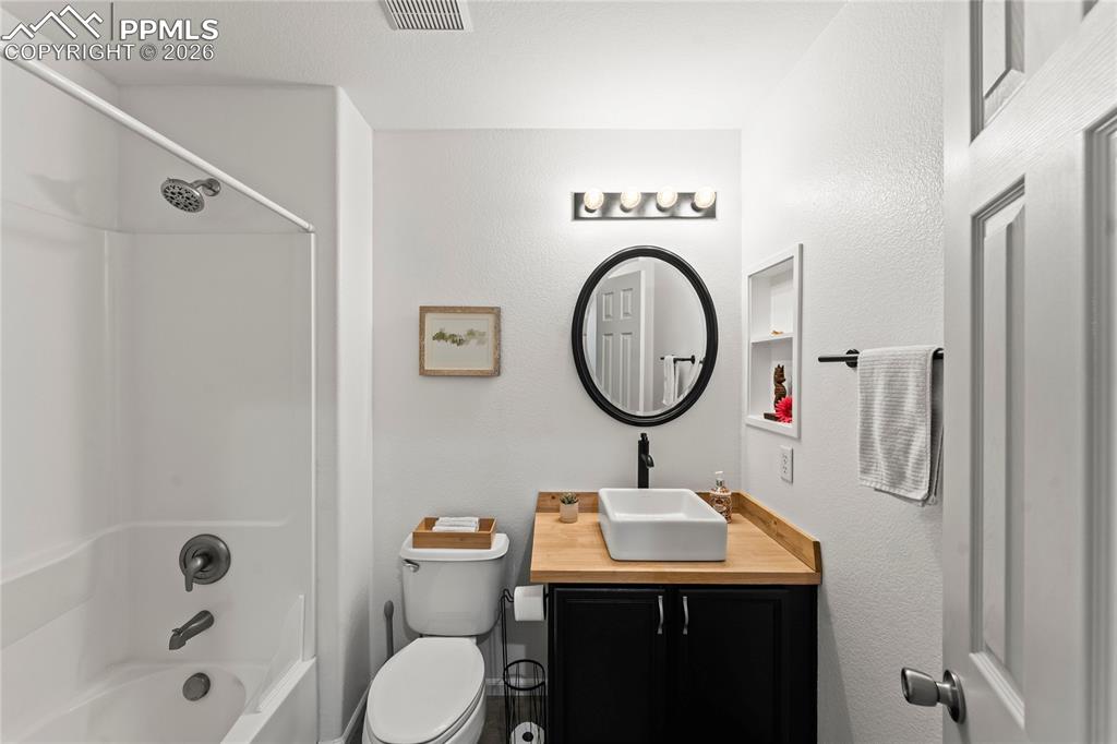 7362 Sandy Springs Point Fountain, CO 80817 - Photo 26 of 41 a bathroom with a sink a toilet and a shower