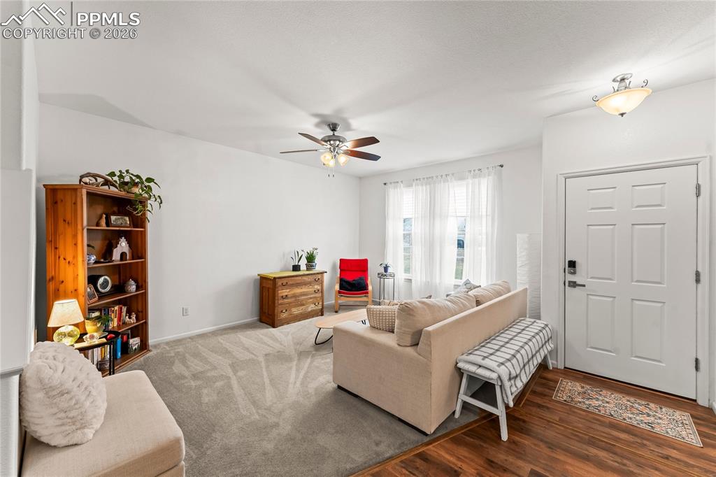 7362 Sandy Springs Point Fountain, CO 80817 - Photo 6 of 41 a living room with furniture and a wooden floor