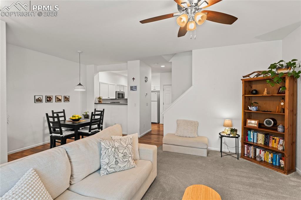 7362 Sandy Springs Point Fountain, CO 80817 - Photo 10 of 41 a living room with furniture cabinets and wooden floor