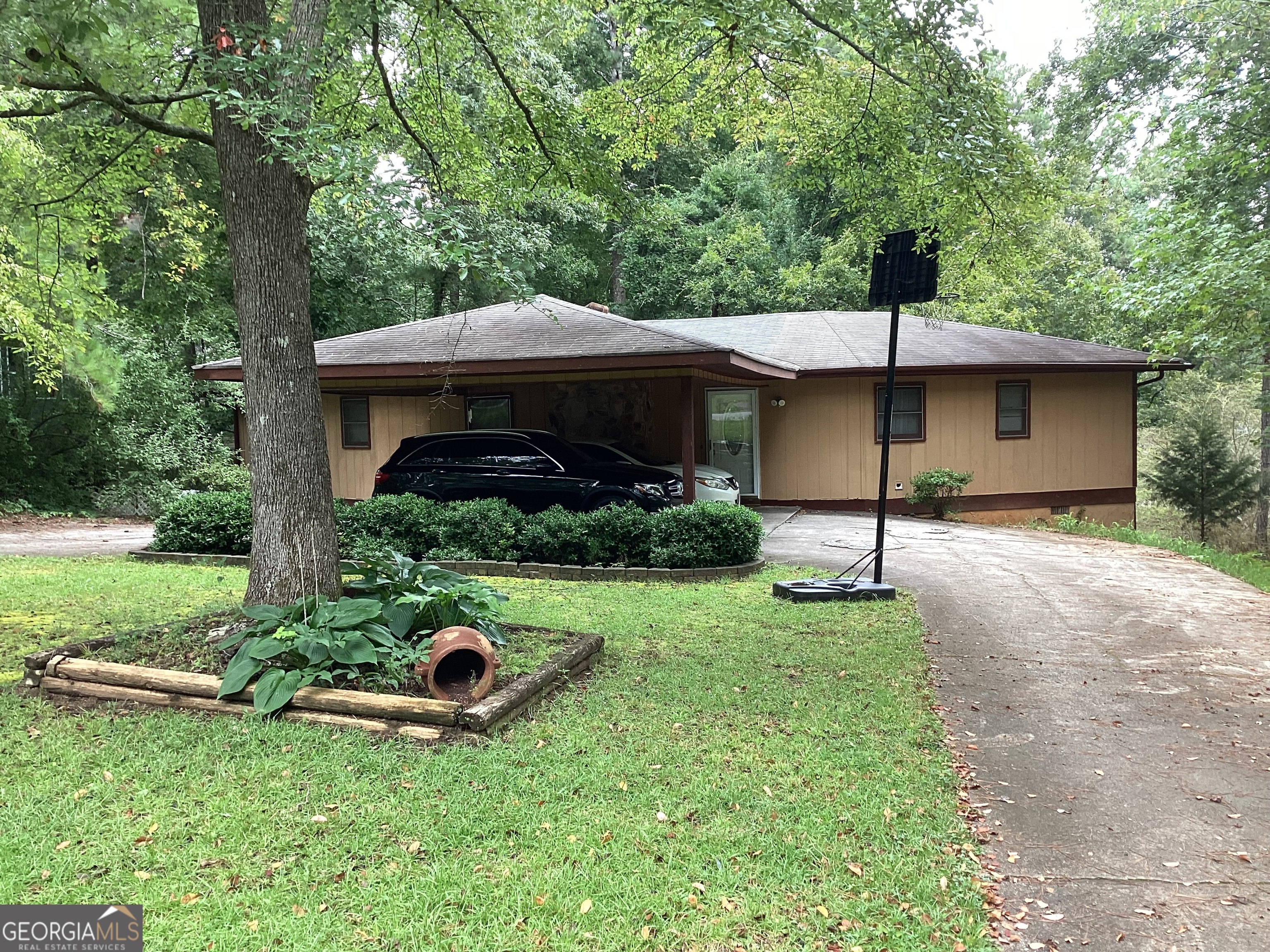 a front view of a house with garden